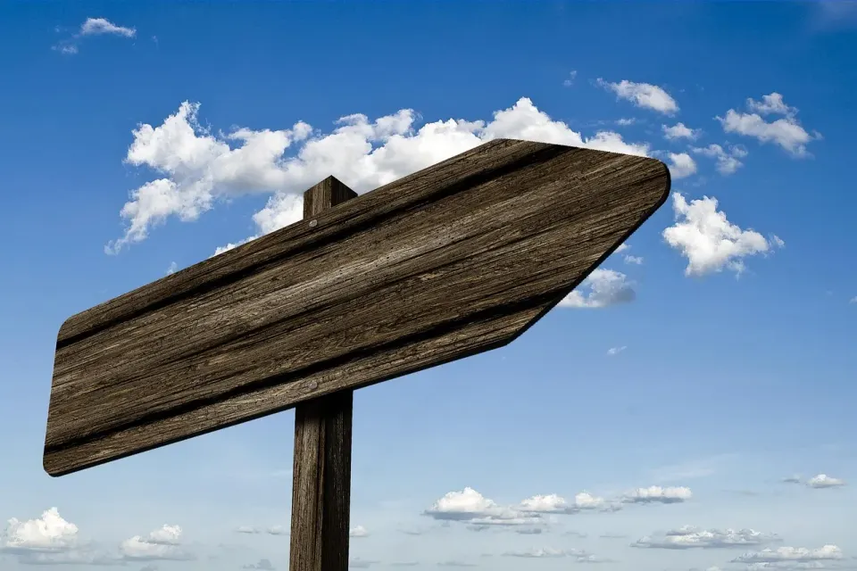 A wooden signpost pointing in different directions