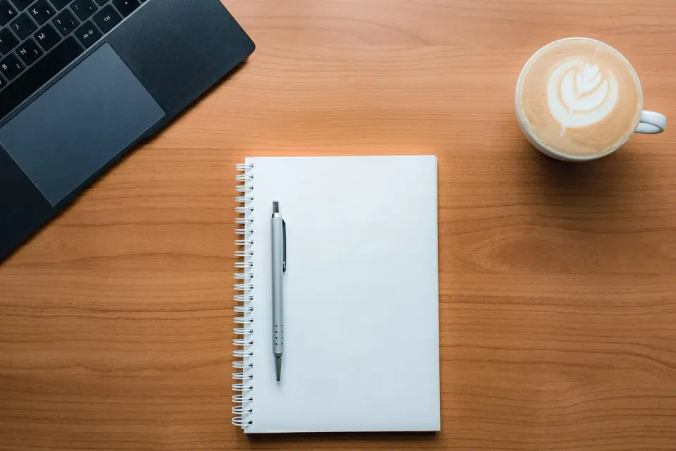 A checklist and pen on a notebook, a picture of the manual checks that confirm rank data