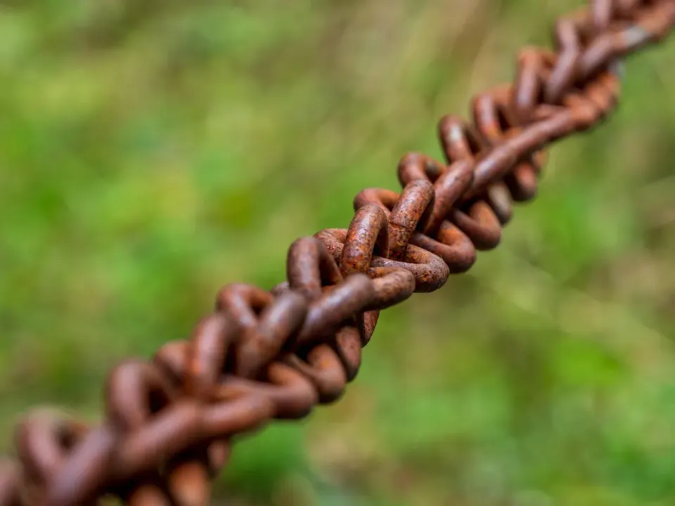 Close-up of a heavy iron chain with interlocking metal links