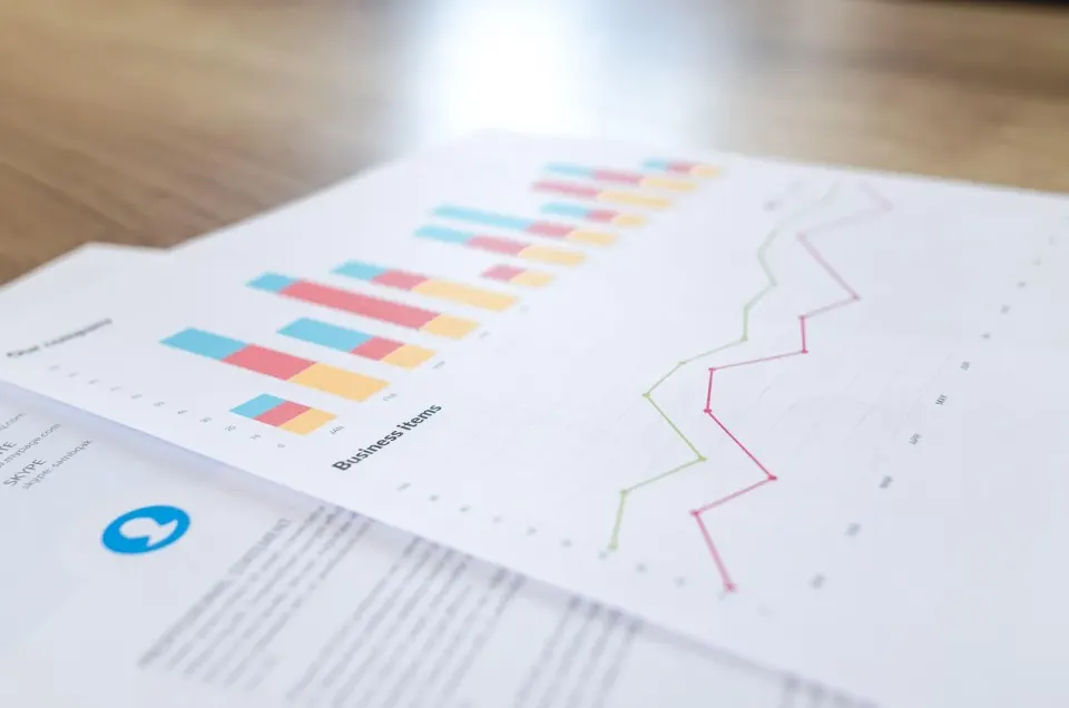 Blurred business analytics charts and figures on paper