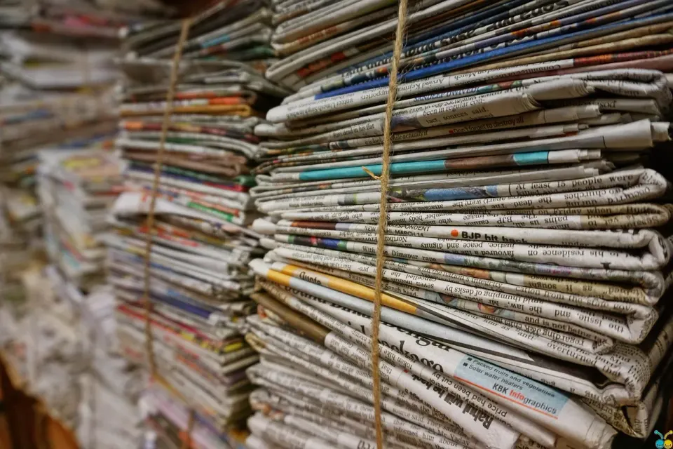 A bundle of newspapers tied with jute rope