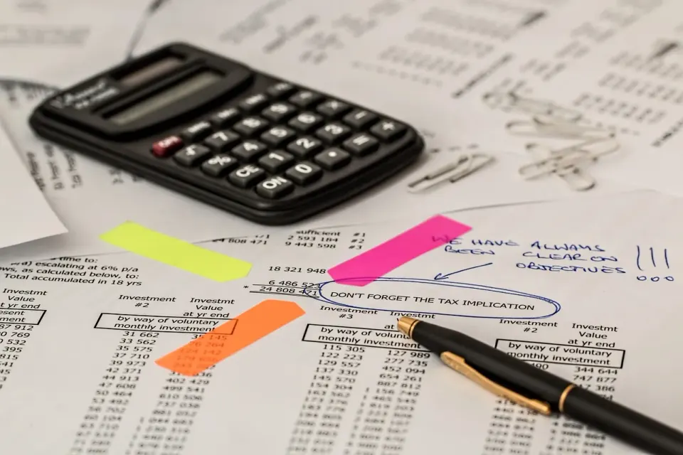 A calculator on top of printed financial figures, ready for an audit