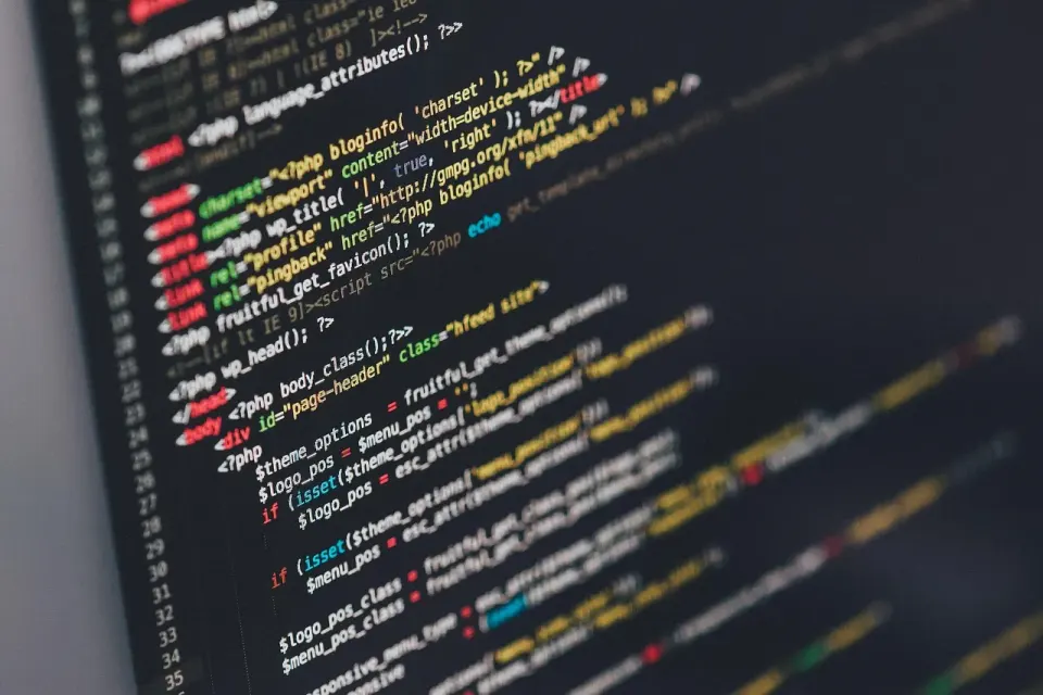 Lines of colorful source code on a computer monitor