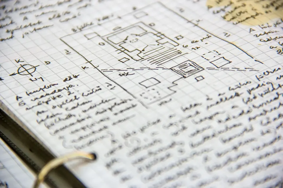 Handwritten notes in an open notepad