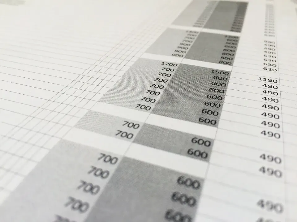 Spreadsheet on a monitor filled with rows of numbers